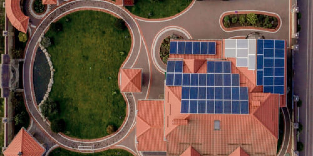 aerial-top-view-new-modern-residential-house-cottage-with-blue-panels