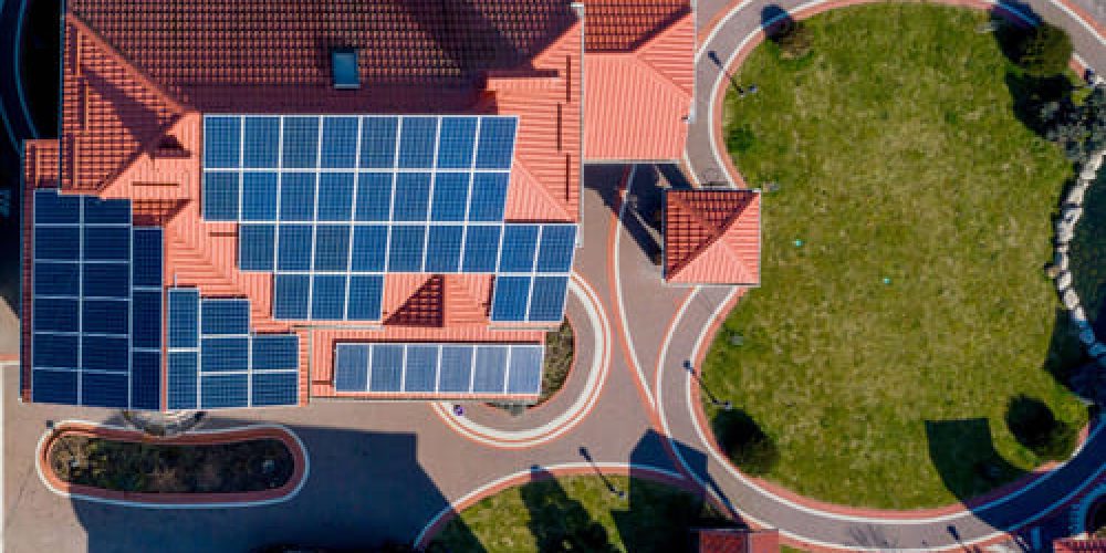aerial-top-view-private-house-with-paved-yard-with-green-grass-lawn-with-concrete-foundation-floor