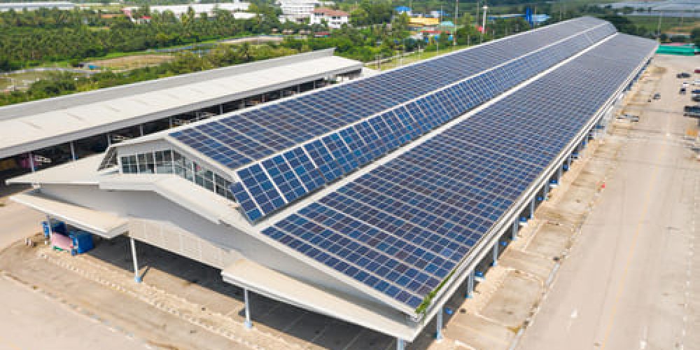 aerial-top-view-solar-cells-roof-solar-panels-installed-roof-large-industrial-building-warehouse